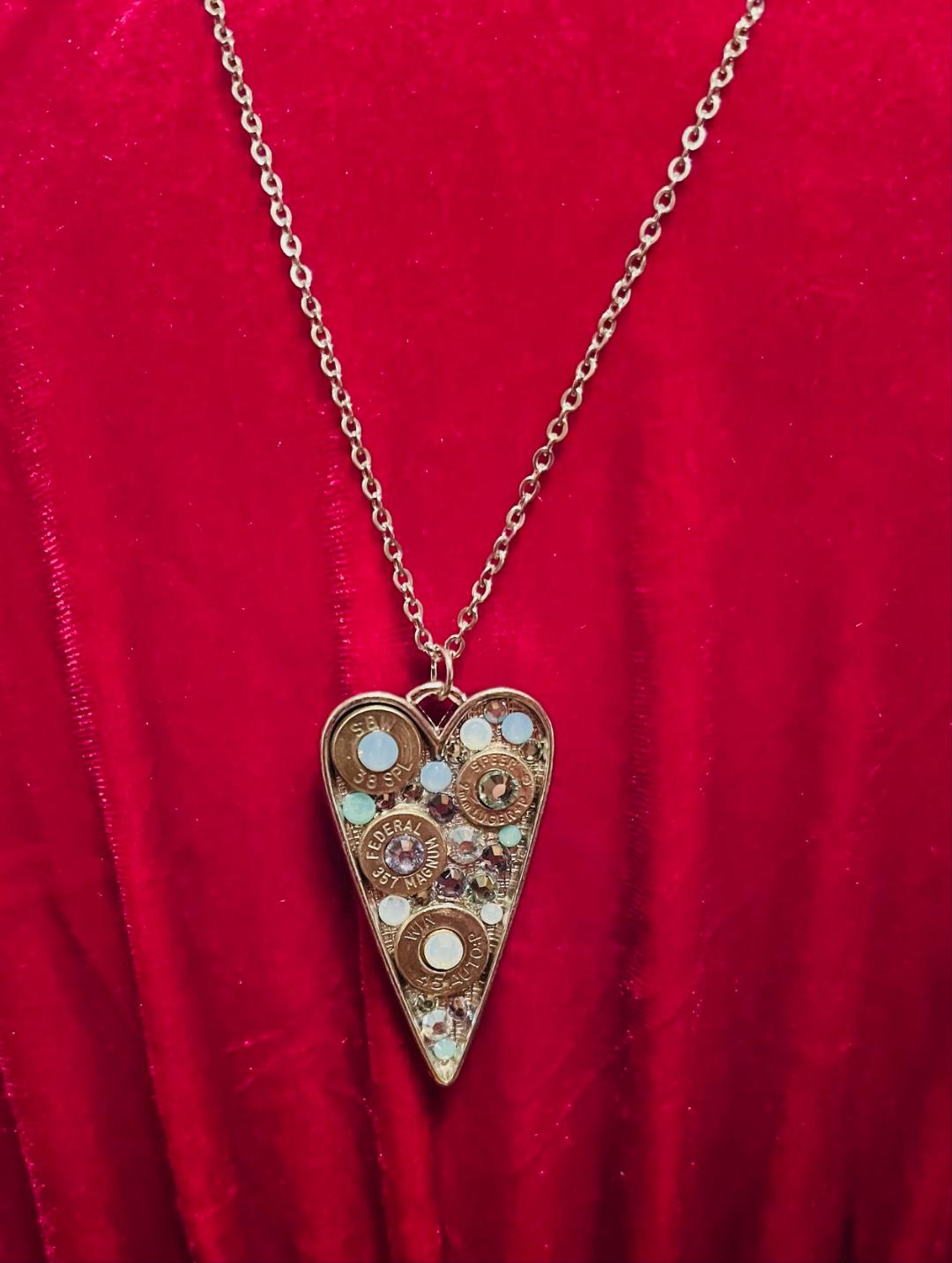 Heart-shaped Swarovski crystal necklace with bullet shell accents