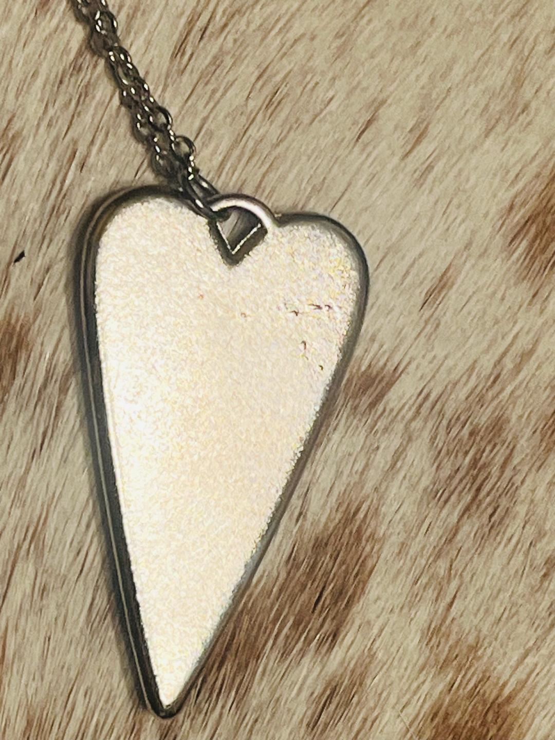 Heart-shaped Swarovski crystal necklace with bullet shell accents