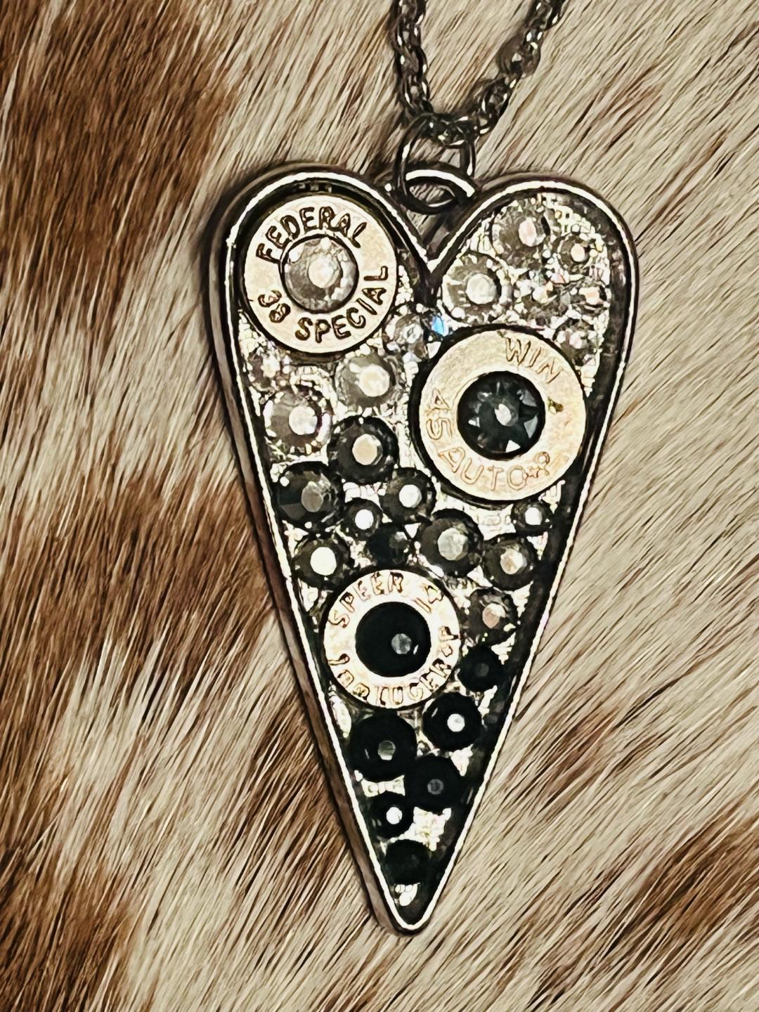 Heart-shaped Swarovski crystal necklace with bullet shell accents