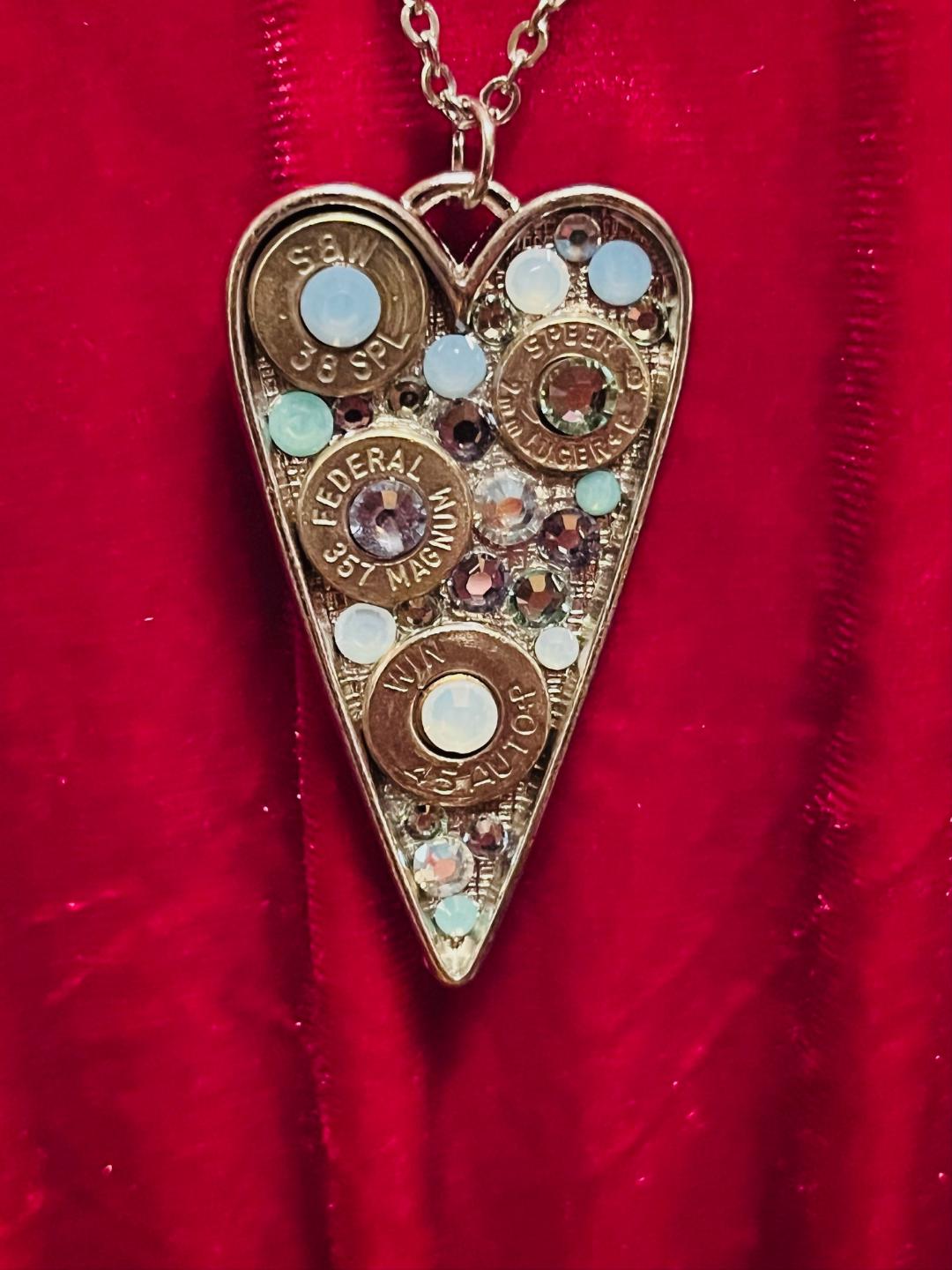 Heart-shaped Swarovski crystal necklace with bullet shell accents