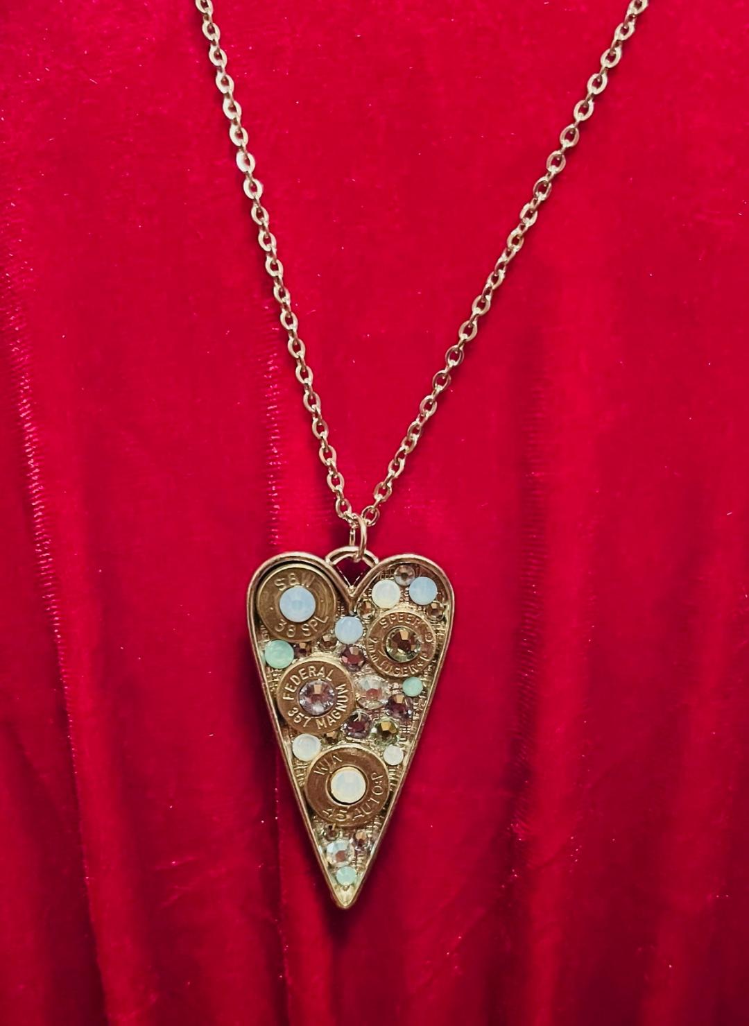Heart-shaped Swarovski crystal necklace with bullet shell accents