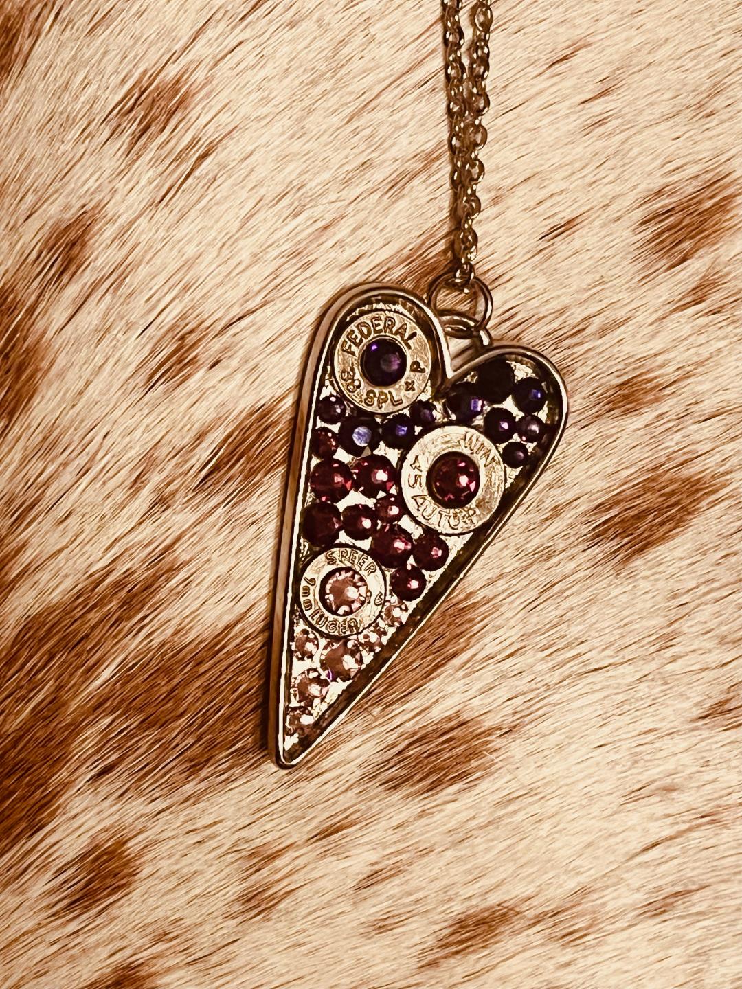 Heart-shaped Swarovski crystal necklace with bullet shell accents