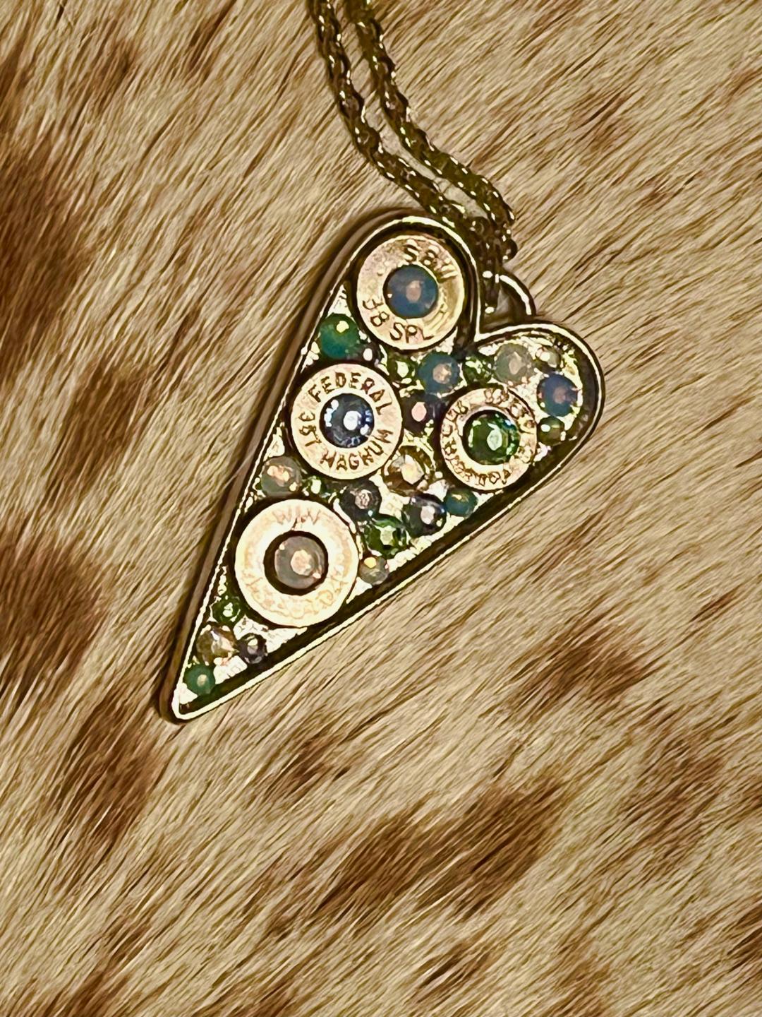 Heart-shaped Swarovski crystal necklace with bullet shell accents